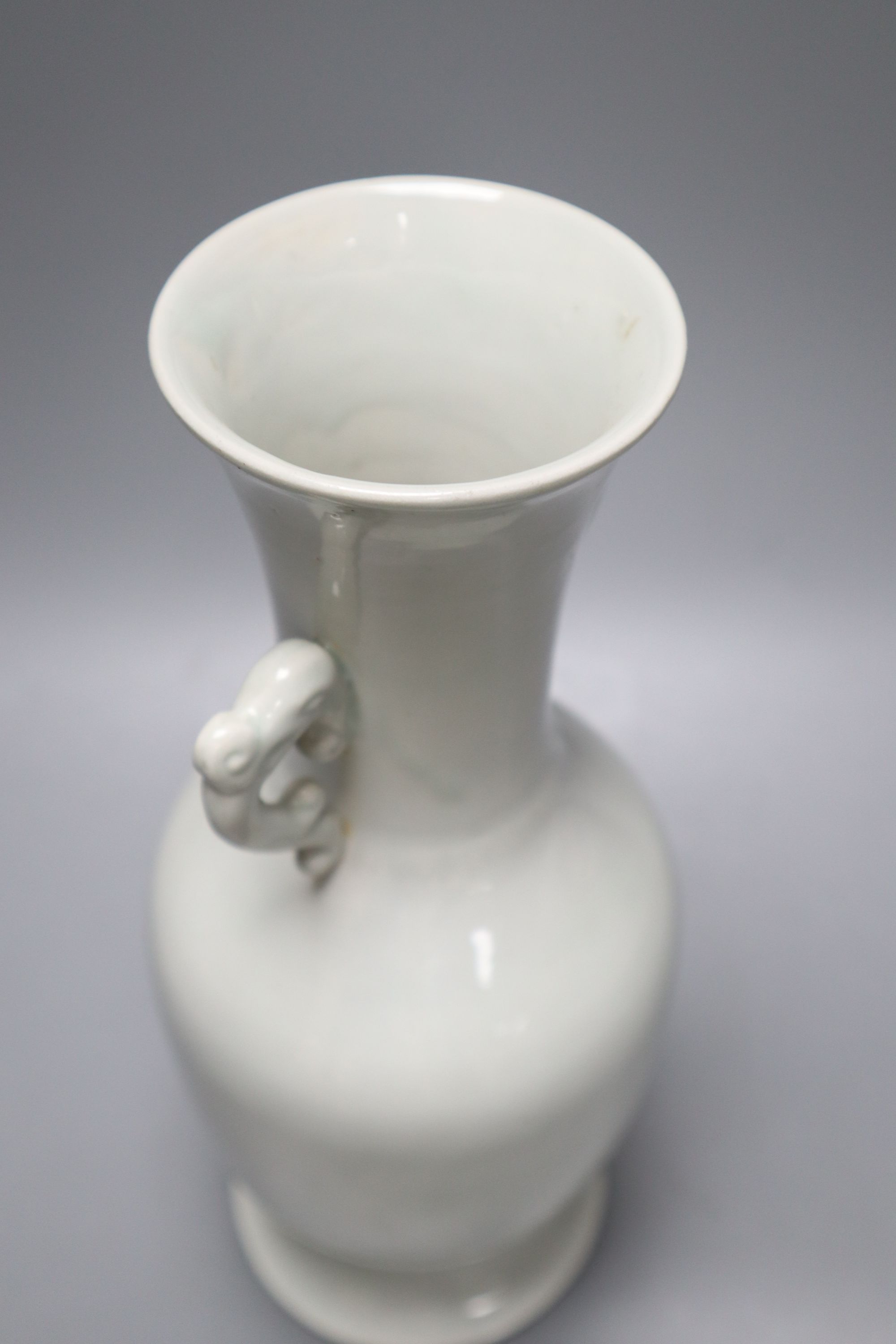 A Chinese white glazed porcelain two handled vase, height 29cm (a.f.)